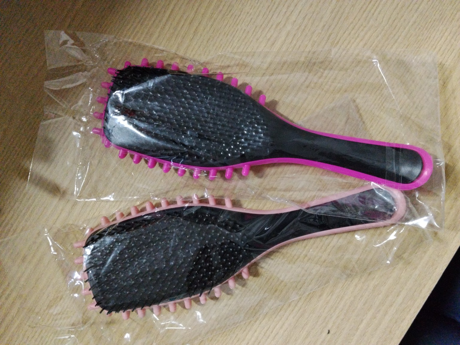 Foto de Escova de cabelo raquete preta e rosa