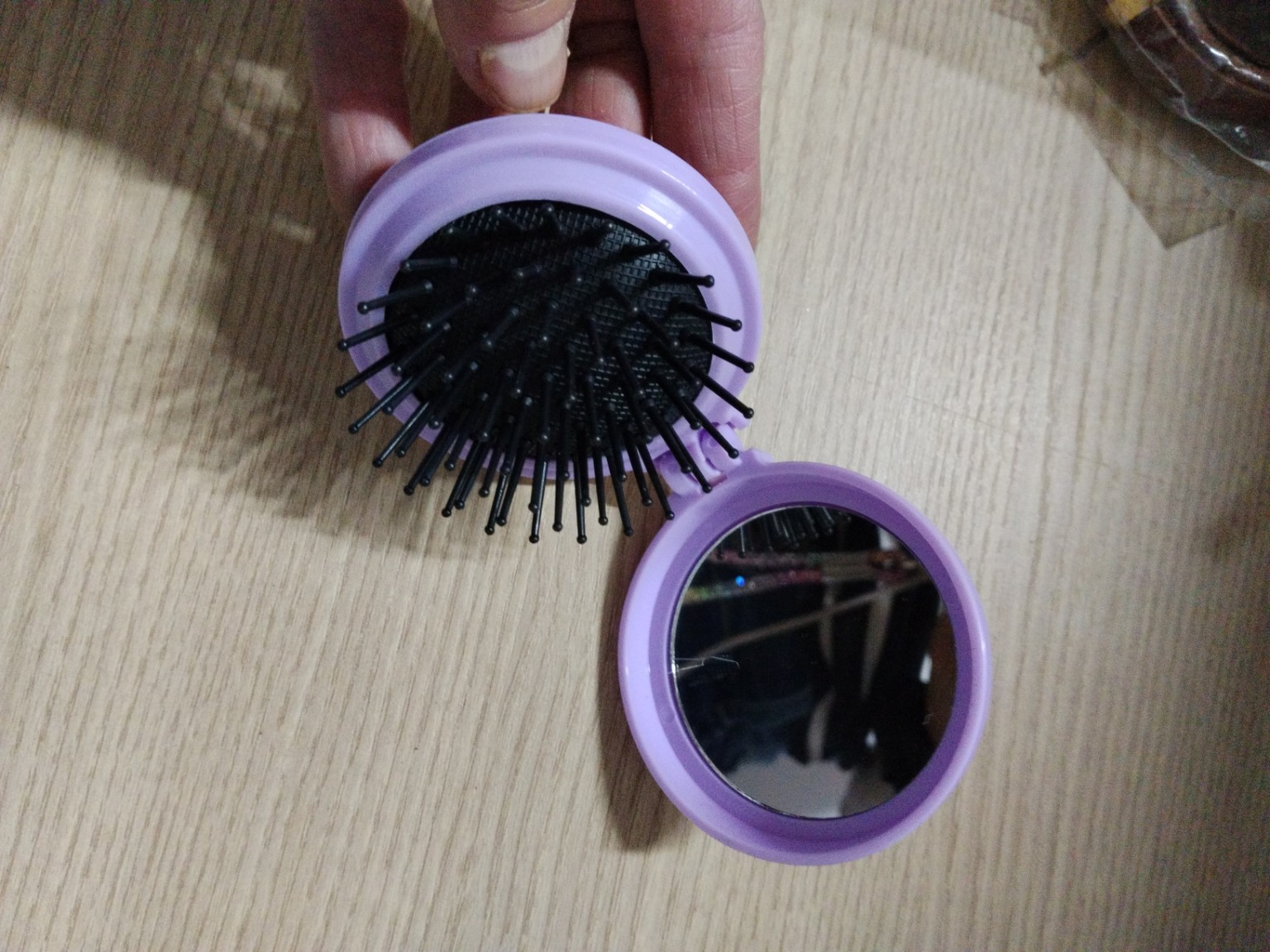Foto de Escova de cabelo dobrável com espelho